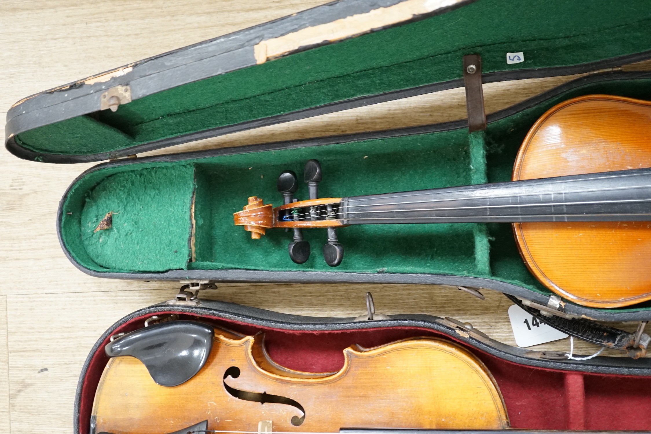 Two cased double back violins